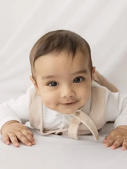 A close-up portrait capturing a gentle, sweet expression.