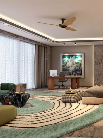 A view of the spacious bedroom, which includes a dedicated work-from-home area. Plush furnishings, atmospheric lighting, and natural stone details mix to create a multi-functional space that is both productive and relaxing.