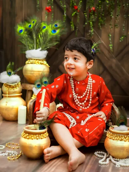 Caught in the act. This little one has a bit of butter on his face, a classic and adorable Kanha moment.