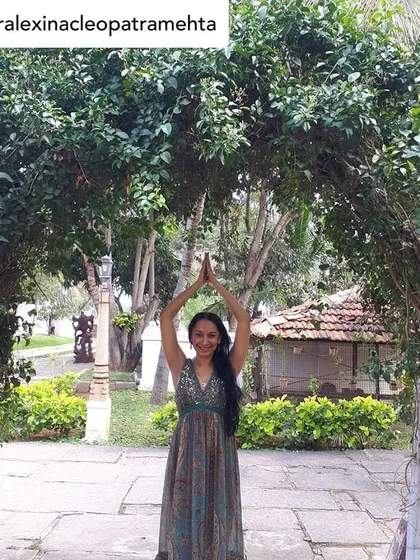 "Every act of healing and kindness... can spark a healing revolution." A guest, Dr. Alexina Mehta, strikes a yoga pose in our garden, beautifully articulating the holistic philosophy that health is the complete well-being of our spiritual, emotional, and physical selves.