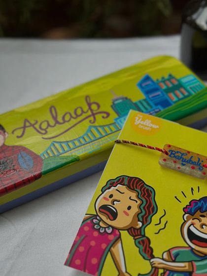 Rakhi combos you would love. This set includes a personalized pencil box and a matching 'Bahubali' Rakhi.