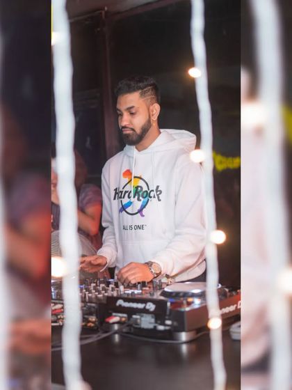 Another angle from the same set, seen through the club's decor. No matter the venue, my dedication to the craft remains the same.