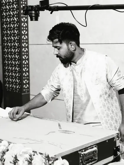 A black and white shot of me at work during the Rotary Club event in Muzaffarnagar. This captures the focus and precision required during a live performance, where every movement of the hand matters.