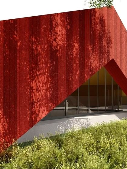 A concept image for the same project, showing a monolithic red structure emerging from a grassy slope. The triangular entrance portal creates a dramatic sense of arrival.