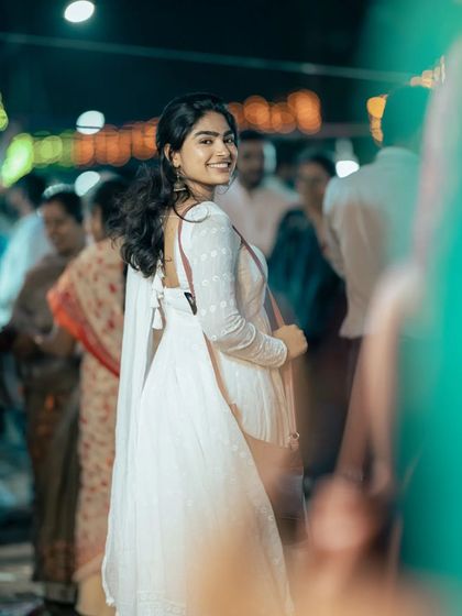 A smiling, over-the-shoulder shot from the fair. It shows how the makeup looks natural and pretty in a real-world, crowded environment.