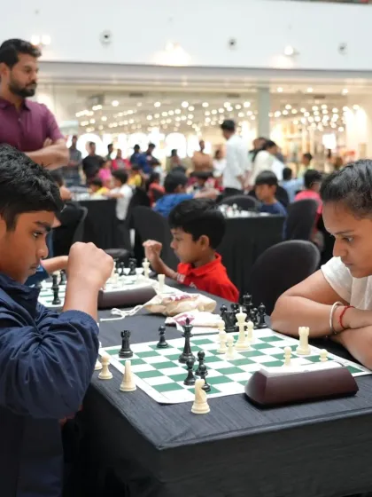 The focus is intense during a tournament match. We coach players of all ages, from young children to adults, helping them sharpen their strategic thinking under pressure.