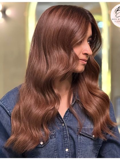 Another profile shot showcasing the beautiful waves and rich tones of this earthy, elegant brown hair color.