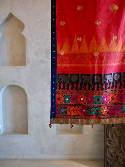 Another detail shot of the runner, highlighting the metal thread embroidery within the Balinese Endek fabric. It's these subtle, rich details that make each textile so special.