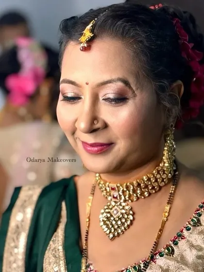 The same client in warm ring light. My makeup techniques ensure the skin looks great under any lighting condition.