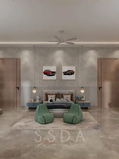 A front view of the kids' bedroom, showing the symmetrical placement of doors and the playful car artwork above the bed. Green beanbags add a fun pop of color to the neutral space.