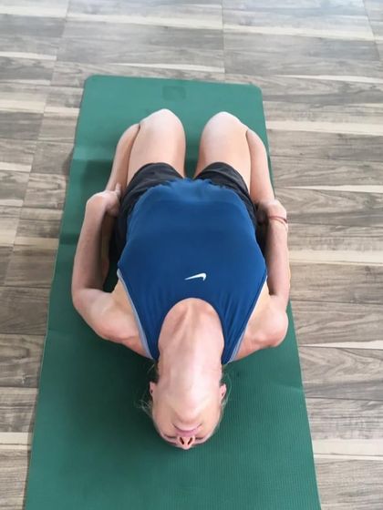 A guest in Matsyasana (Fish Pose), a heart-opening posture. Our yoga sequences are designed to complement the Ayurvedic treatments, enhancing their therapeutic effects.