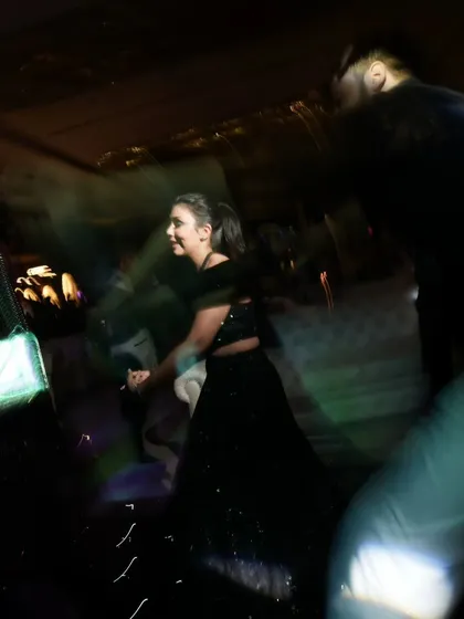 Capturing the blur of motion on the dance floor. This creative shot with a slow shutter speed conveys the energy and movement of the celebration.