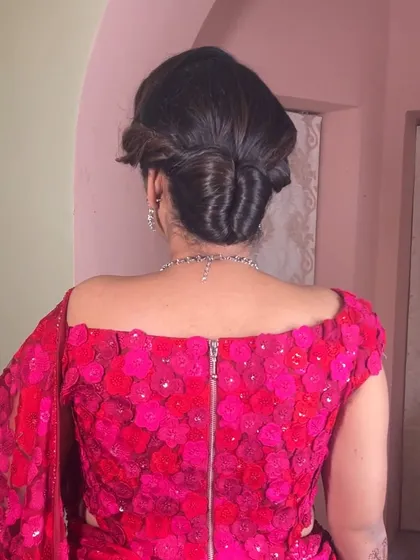 A back view of the intricate updo, showing the beautiful twists and folds of the hair.