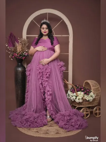 This pose incorporates a rustic baby pram filled with flowers, symbolizing the new life on the way. A beautiful blend of regal and rustic elements.