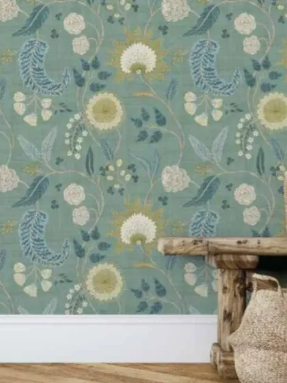 A folk-art inspired floral pattern in a muted teal color. This design adds a touch of rustic charm and character to the wall.