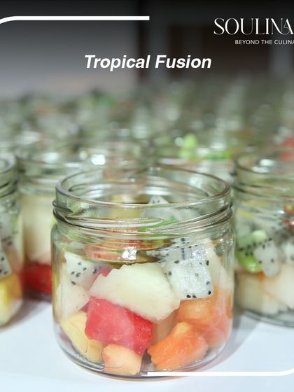 A tropical fusion fruit salad served in a reusable glass jar. This is part of our commitment to providing wholesome experiences while being mindful of our environmental impact.