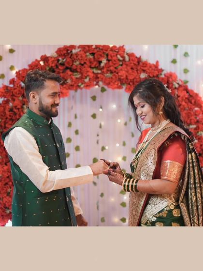 The moment of exchange between Dipesh and Hemangi, set against a beautiful floral arch. I ensure the decor and ambiance of your venue are part of the story.