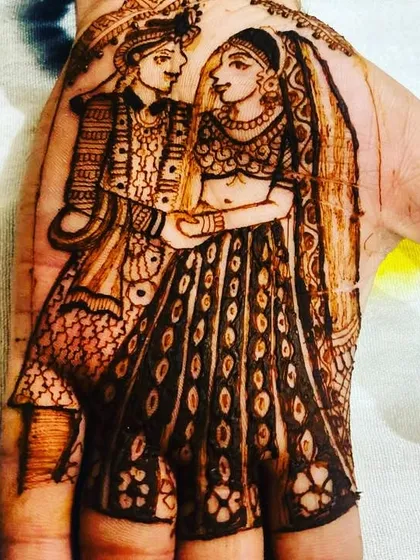 Your love story, drawn on your hands. I specialize in creating detailed portraits like this one, capturing the bride and groom in henna as a beautiful, personal keepsake of their special day.