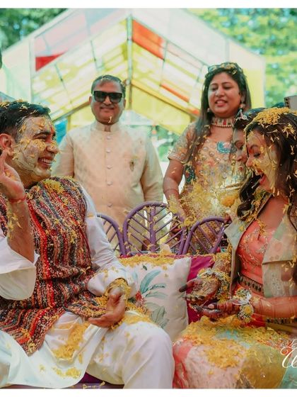 Laughter and joy are the main ingredients of a great Haldi. This photo captures the couple and their families sharing a laugh during the fun-filled rituals.