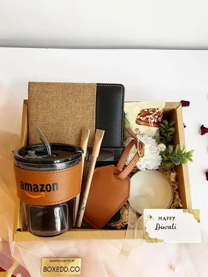 Sustainability meets style in this eco-friendly gift set designed for Amazon. Featuring a branded jute notebook, a glass tumbler with a leather-style sleeve, and other sustainable items, this hamper proves that corporate gifts can be both thoughtful and green.