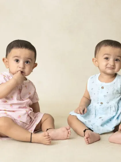 A collection of simple, classic portraits of twin babies. Without props or themes, their individual expressions and connection are beautifully highlighted.