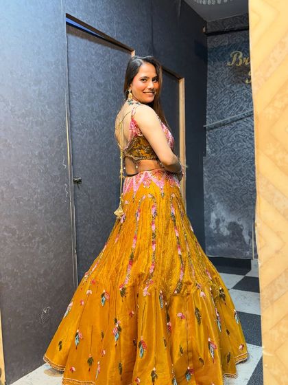 Another happy client ready to flex her Haldi look. The back of the lehenga is just as stunning.