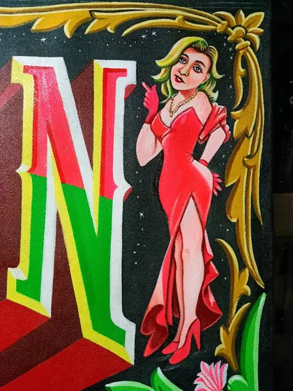 Detail of another stylishly dressed woman from the Neon Moon sign.