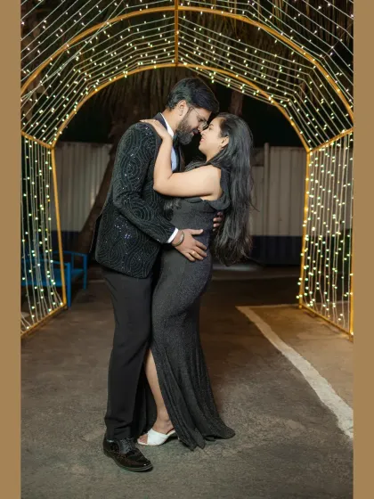 Fairy lights can turn any location into a magical wonderland. For this evening pre-wedding shoot, we used a tunnel of lights to frame the couple in a warm, romantic glow, creating an intimate and dreamy atmosphere.