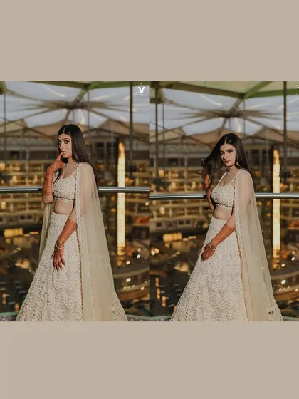 A collage of the bride in her modern white sangeet lehenga. The shots capture her confident poses against a backdrop of city lights, showcasing her chic and stylish look.