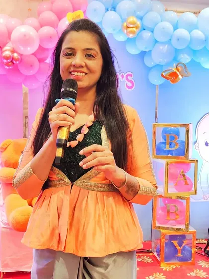 A happy moment on stage. My passion is to bring smiles to people's faces and make their special occasions truly memorable, just like this beautiful baby shower.