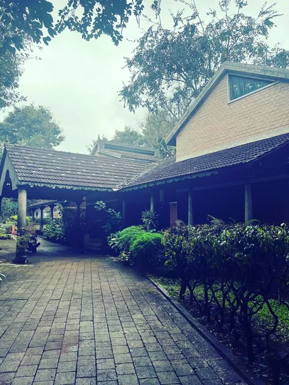 The pathway to our meditation hall, surrounded by the quiet beauty of our retreat grounds. Every corner of this space is filled with a palpable sense of peace.