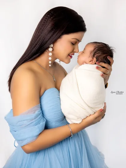 A close-up of the mother and her baby boy, capturing the loving gaze between them.