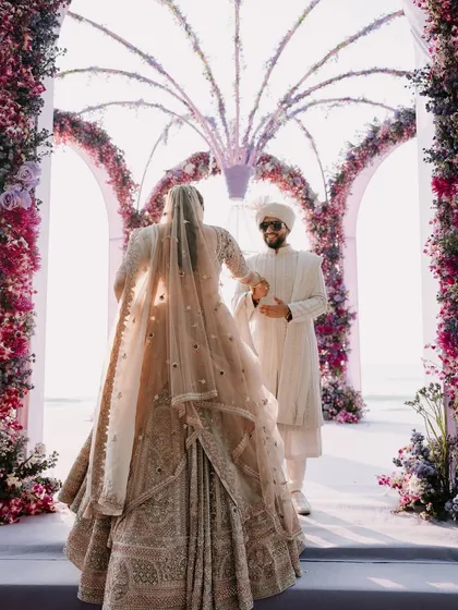 The bride's grand entrance to the mandap, a pivotal and emotional moment of the wedding day.