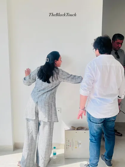 Our team marking up walls and planning layouts directly on-site. This hands-on approach helps visualize the space and confirm placements.