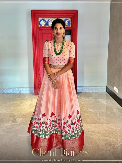 Another beautiful shot of our client in the peach anarkali, a testament to our timeless yet innovative designs.