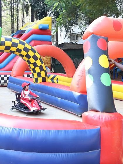 A staff member ensures the go-kart track is ready for the next little racer. I prioritize safety and organization in all activities.