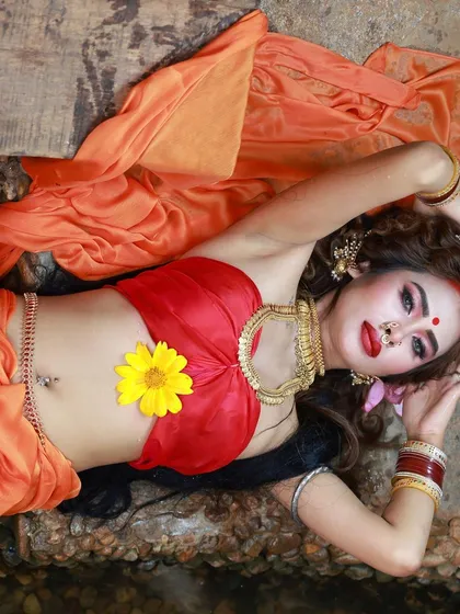 An artistic overhead shot from our goddess-themed collaboration. The placement of the flower and the model's pose create a beautiful, symbolic image.