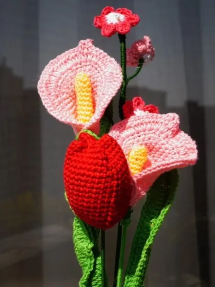 This bouquet of crochet lilies and a tulip is a testament to the idea that love can be expressed in many forms, not just with traditional roses.