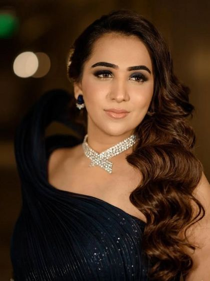 A close-up of a client's glamorous look. This shows my focus on ensuring the hair, makeup, and jewelry all work together to create a complete and polished final result.