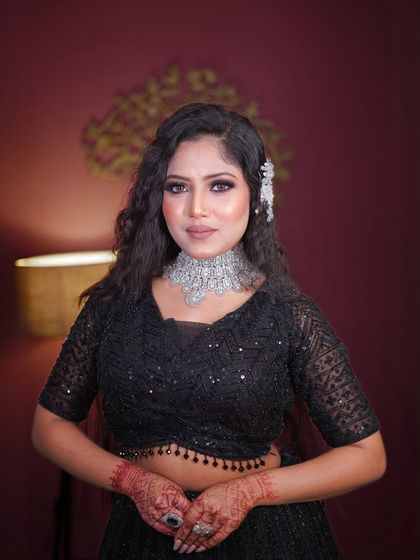 A classic portrait pose in our stunning all-black ensemble.