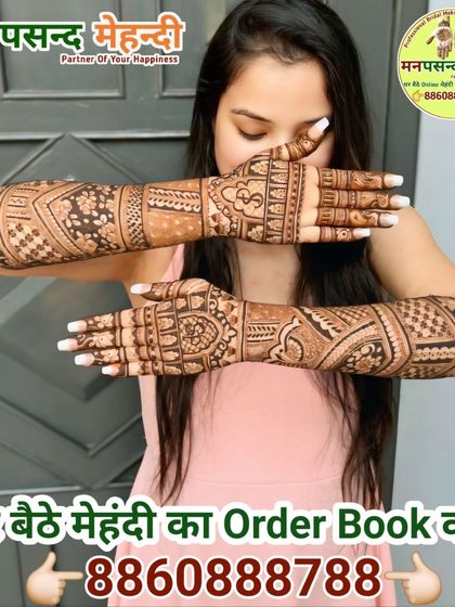 A client posing with her beautiful full-arm mehndi. We ensure every client leaves with a design they absolutely love.