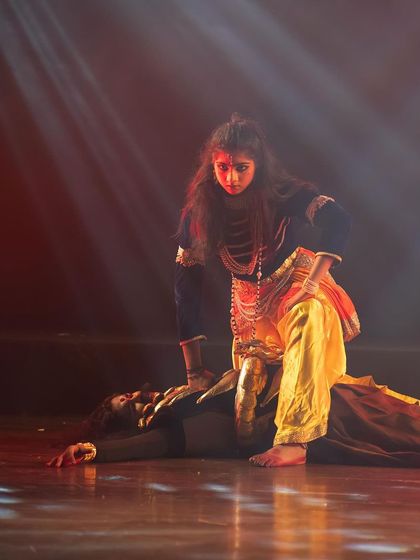 A powerful depiction of Krishna's victory over the tyrannical king Kamsa. The intense expressions and dramatic staging make this a climactic and memorable moment in the production.