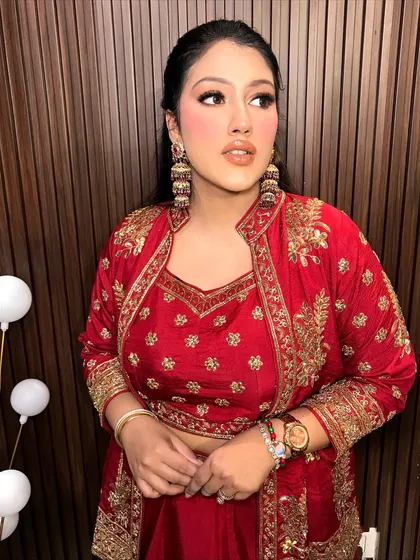A confident pose, showing off the full effect of her styled look.