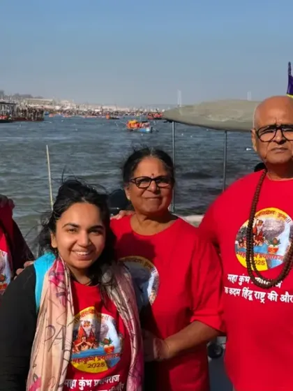 Rooted in culture, styled by WYO. This family shows their devotion during Kumbh Mela with matching red t-shirts featuring a spiritual print.