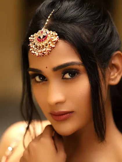 A striking close-up of the talented Bigg Boss fame actress Poornima Ravi. For this shoot, I created a bold and defined eye makeup look with sharp winged eyeliner and a matte lip, perfect for professional photoshoots and camera work.