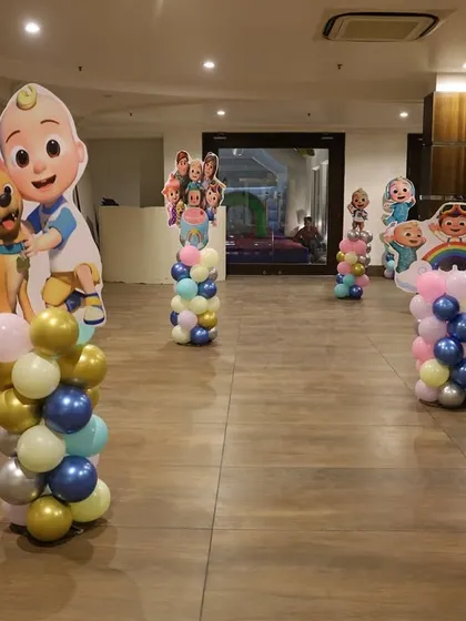 We placed Cocomelon character cutouts on balloon pillars around the room to make the space feel more interactive and fun for the kids.