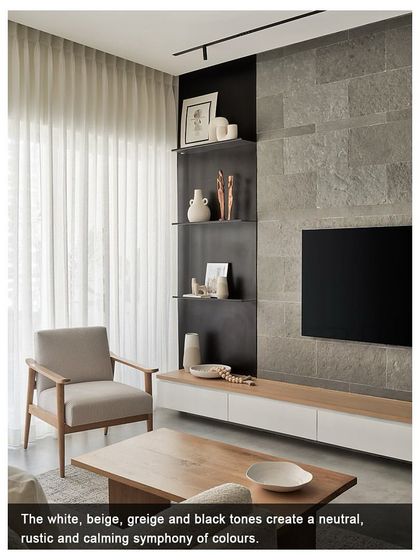 A magazine feature showcasing the living room of the Zen House. The image highlights the neutral, rustic, and calming symphony of colors, including white, beige, and black tones.