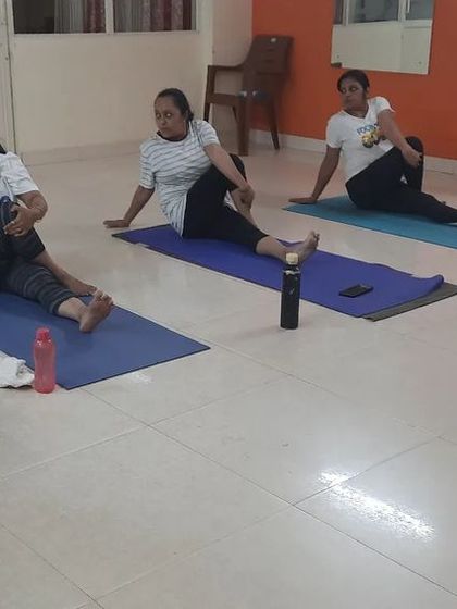 A duplicate of image 41, showing the seated spinal twist practice.