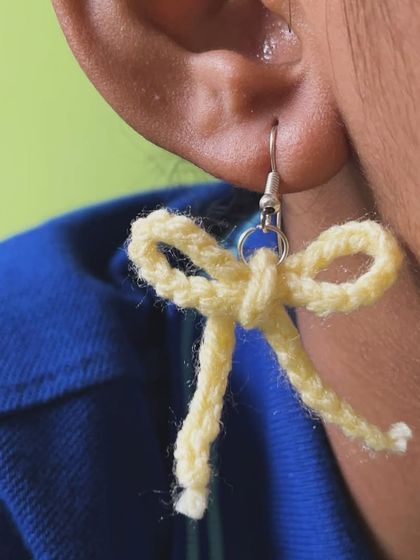 A pair of my bow earrings in a soft yellow color. I can make these in any shade you like to match your favorite outfit.
