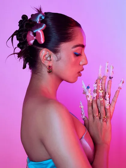 A side profile showcasing the length and dimension of the 3D nails. I used a mix of sculpting gels and pre-made charms to create this multi-layered, textured look.